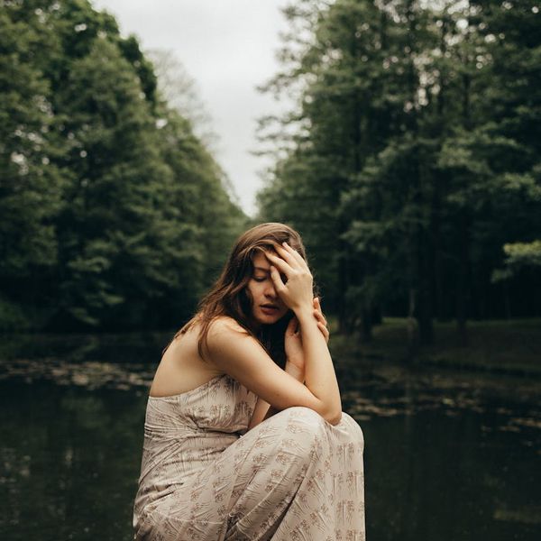 Person meditating in a serene environment with soft lighting, symbolizing mental calm.